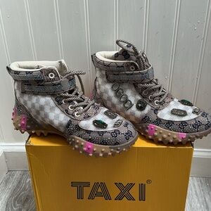 Taxi brand casual sneakers featuring a rhinestone-embellished monogram pattern